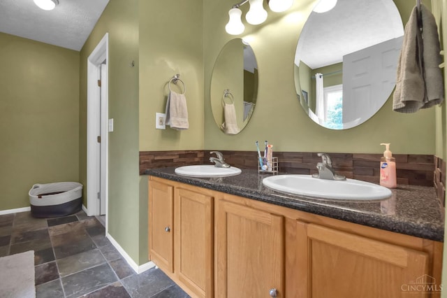 4411 Todd Rose Ct, Union Twp, OH 45244 - bathroom featuring double vanity and stone finish flooring