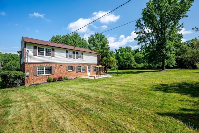 2724 Bentley Ct, Anderson Twp, OH 45244 - rear view of house featuring brick siding, a patio, and a yard
