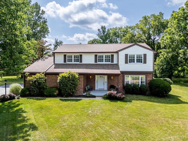 2724 Bentley Ct, Anderson Twp, OH 45244 - traditional-style house featuring a front yard, brick siding, and a porch