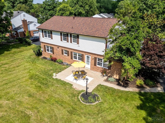 2724 Bentley Ct, Anderson Twp, OH 45244 - back of house featuring a patio area, brick siding, a yard, and roof with shingles