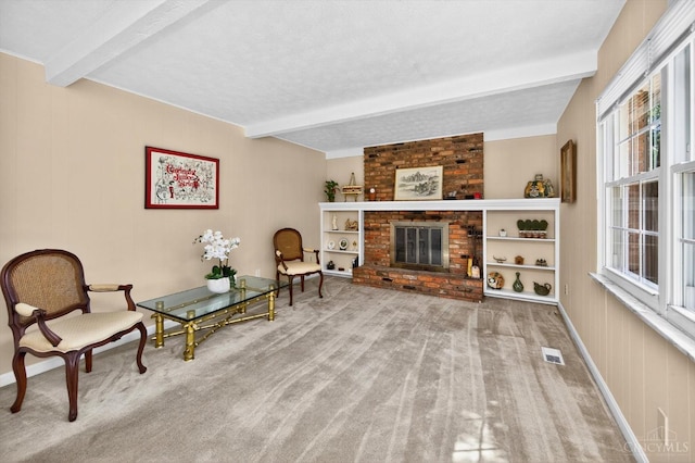 2724 Bentley Ct, Anderson Twp, OH 45244 - sitting room with beamed ceiling, healthy amount of natural light, carpet floors, and a fireplace