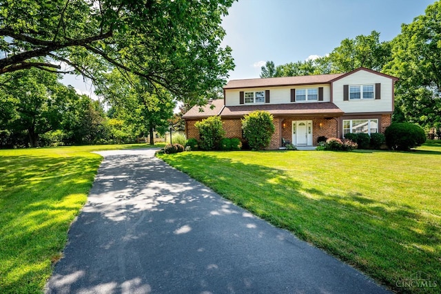2724 Bentley Ct, Anderson Twp, OH 45244 - traditional-style house with brick siding, a front lawn, and driveway