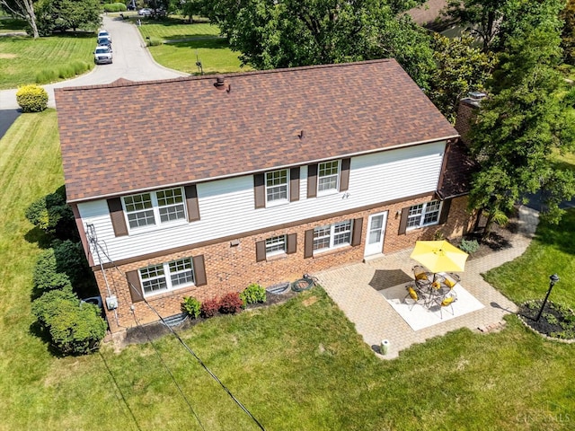 2724 Bentley Ct, Anderson Twp, OH 45244 - back of property featuring brick siding, a patio, a lawn, and roof with shingles