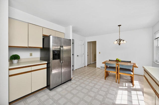 2724 Bentley Ct, Anderson Twp, OH 45244 - kitchen with stainless steel fridge with ice dispenser, a chandelier, light countertops, and light floors