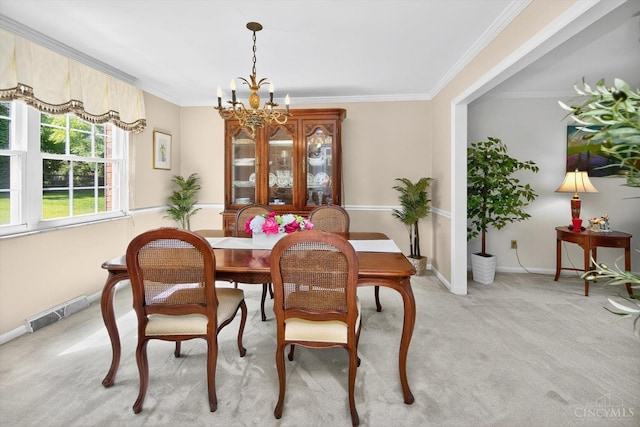 2724 Bentley Ct, Anderson Twp, OH 45244 - dining room featuring light carpet, ornamental molding, and a chandelier