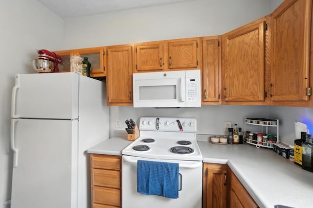 3254 Berwyn Pl, Cincinnati, OH 45209 - kitchen featuring white appliances, light countertops, and brown cabinets