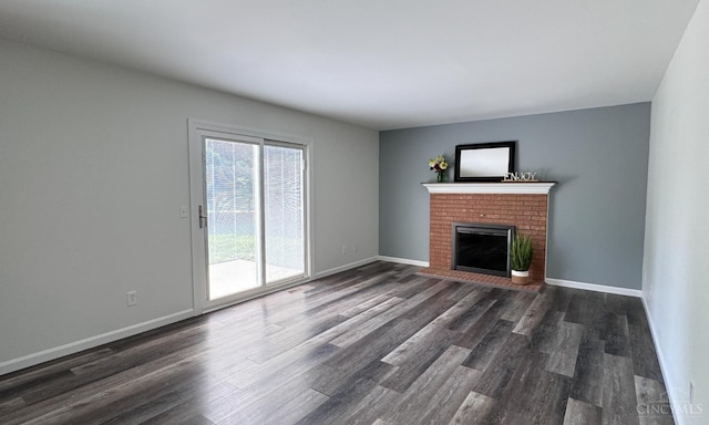 7102 Lookout Ct, Liberty Twp, OH 45011 - unfurnished living room with a brick fireplace and dark wood-type flooring