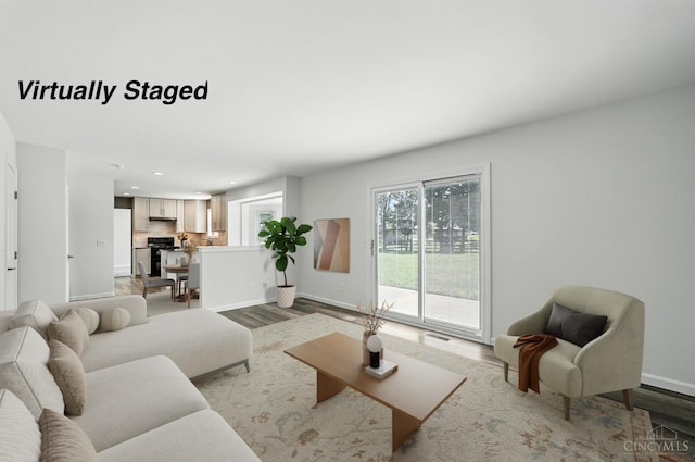 7102 Lookout Ct, Liberty Twp, OH 45011 - living room featuring wood finished floors and recessed lighting