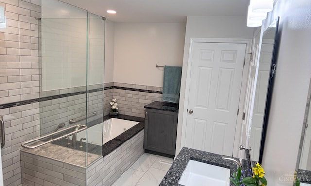 7102 Lookout Ct, Liberty Twp, OH 45011 - bathroom with a bath, vanity, a shower stall, marble look tiles, and recessed lighting