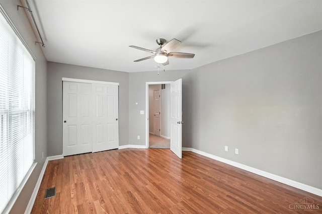 7102 Lookout Ct, Liberty Twp, OH 45011 - unfurnished bedroom with wood finished floors, a closet, and a ceiling fan