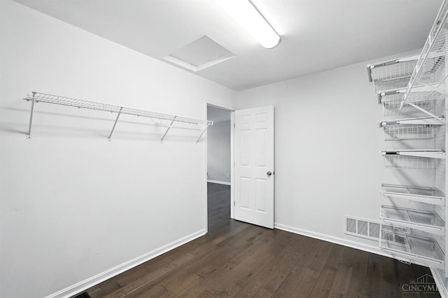 7102 Lookout Ct, Liberty Twp, OH 45011 - walk in closet with dark wood-style flooring and attic access