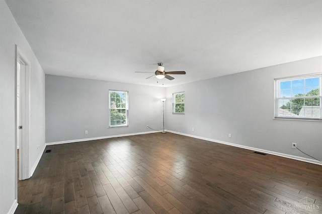 7102 Lookout Ct, Liberty Twp, OH 45011 - spare room with plenty of natural light, a ceiling fan, and dark wood-style flooring