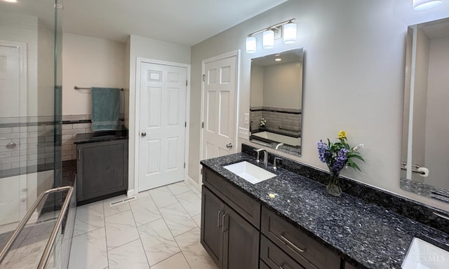 7102 Lookout Ct, Liberty Twp, OH 45011 - full bathroom with marble look tiles, vanity, a tub to relax in, a shower with shower door, and decorative backsplash