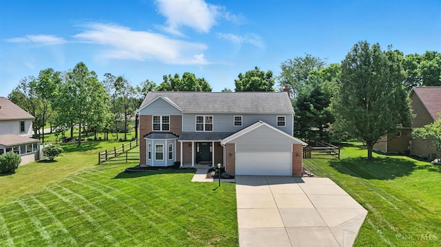 7102 Lookout Ct, Liberty Twp, OH 45011 - traditional home with driveway, brick siding, and an attached garage
