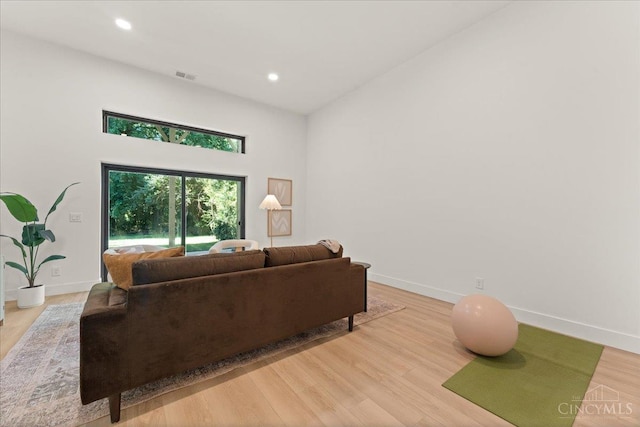 963 Windsor St, Cincinnati, OH 45206 - living room with a high ceiling, recessed lighting, and light wood-type flooring