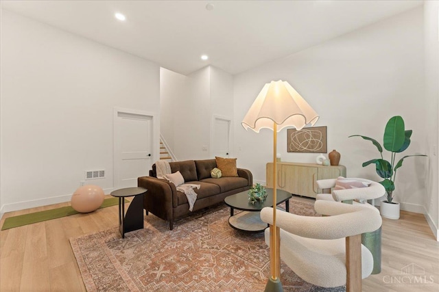 963 Windsor St, Cincinnati, OH 45206 - living room with light wood-style floors, stairs, and recessed lighting