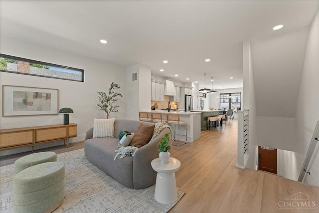 963 Windsor St, Cincinnati, OH 45206 - living room featuring light wood finished floors and recessed lighting