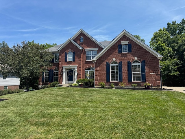 1031 Westchester, Union Twp, OH 45244 - georgian-style home featuring a front lawn and brick siding