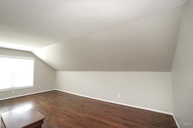 1031 Westchester, Union Twp, OH 45244 - additional living space featuring vaulted ceiling and dark wood-type flooring
