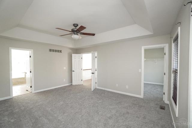 1031 Westchester, Union Twp, OH 45244 - unfurnished bedroom featuring a tray ceiling, carpet, a spacious closet, and ensuite bathroom