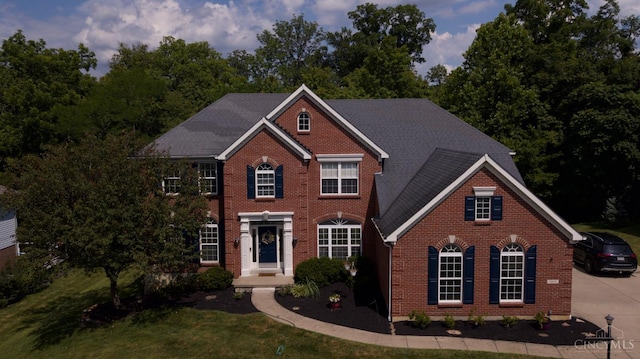 1031 Westchester, Union Twp, OH 45244 - colonial house featuring brick siding and a front lawn