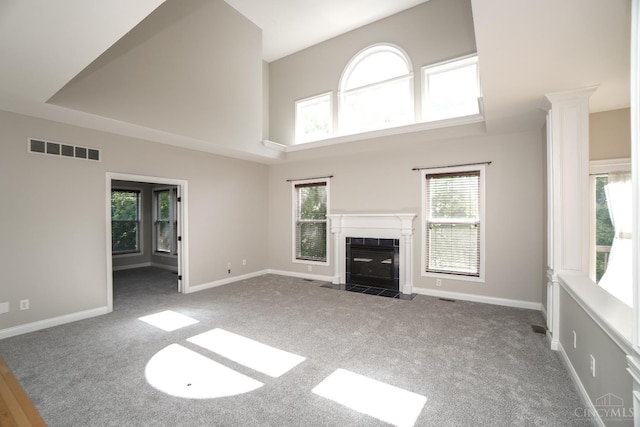 1031 Westchester, Union Twp, OH 45244 - unfurnished living room with carpet, a tile fireplace, and a towering ceiling