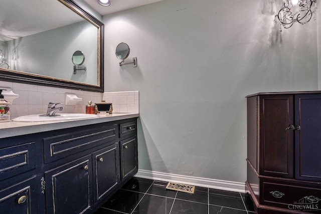 6341 Marshall Rd, Centerville, OH 45459 - bathroom featuring vanity, decorative backsplash, and tile patterned flooring