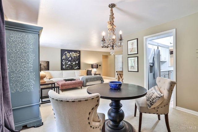 6341 Marshall Rd, Centerville, OH 45459 - dining area featuring a chandelier and light carpet