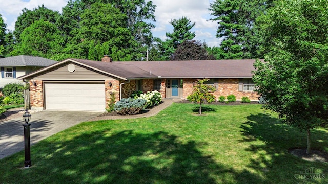 6341 Marshall Rd, Centerville, OH 45459 - view of front of house with an attached garage, brick siding, concrete driveway, and a front lawn
