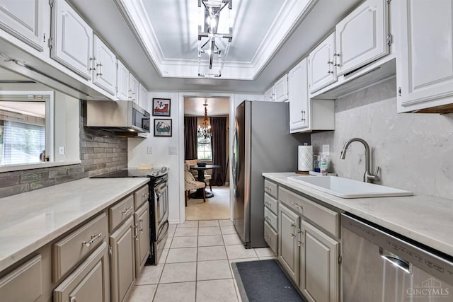 6341 Marshall Rd, Centerville, OH 45459 - kitchen with appliances with stainless steel finishes, backsplash, and white cabinetry