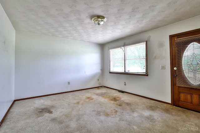 17403 Bloomrose Rd, Sterling Twp, OH 45176 - entryway with light colored carpet and a textured ceiling