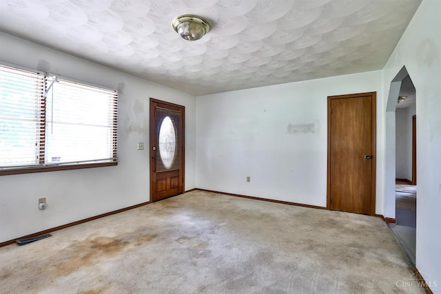 17403 Bloomrose Rd, Sterling Twp, OH 45176 - carpeted foyer entrance featuring baseboards and a textured ceiling