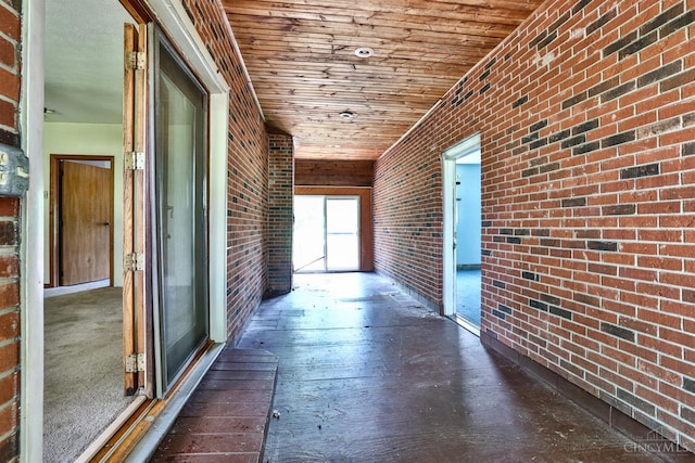 17403 Bloomrose Rd, Sterling Twp, OH 45176 - corridor featuring brick wall, wooden ceiling, and wood-type flooring