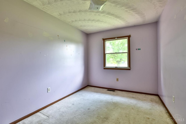 17403 Bloomrose Rd, Sterling Twp, OH 45176 - spare room with light carpet and a textured ceiling