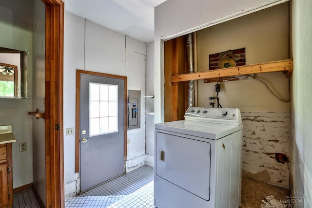 17403 Bloomrose Rd, Sterling Twp, OH 45176 - laundry room with washer / dryer, electric panel, healthy amount of natural light, and light tile patterned floors