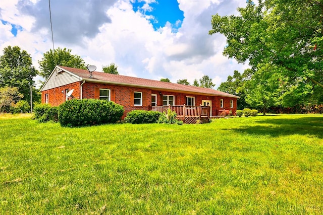 17403 Bloomrose Rd, Sterling Twp, OH 45176 - back of property featuring brick siding, a wooden deck, and a yard
