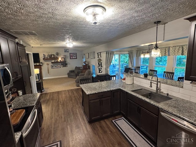 8091 Celestial Cir, Liberty Twp, OH 45044 - kitchen with stainless steel appliances, open floor plan, dark wood-style floors, and decorative light fixtures