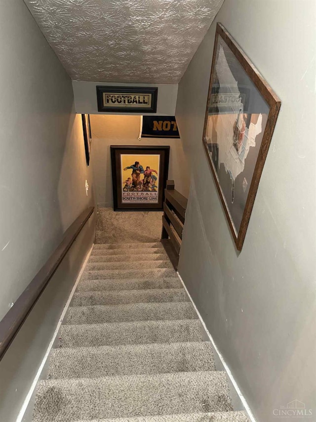 8091 Celestial Cir, Liberty Twp, OH 45044 - stairs with carpet and a textured ceiling