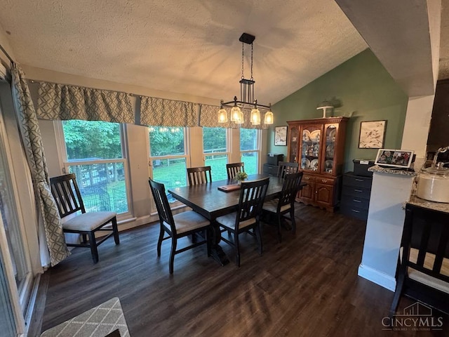 8091 Celestial Cir, Liberty Twp, OH 45044 - dining area with dark wood-style floors, a chandelier, a textured ceiling, and lofted ceiling