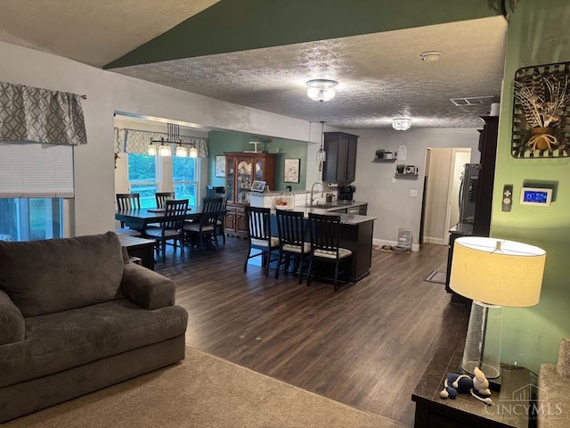 8091 Celestial Cir, Liberty Twp, OH 45044 - living area featuring dark wood-style flooring and a textured ceiling