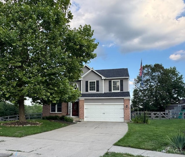 8091 Celestial Cir, Liberty Twp, OH 45044 - view of front of property featuring driveway, a garage, brick siding, and a shingled roof