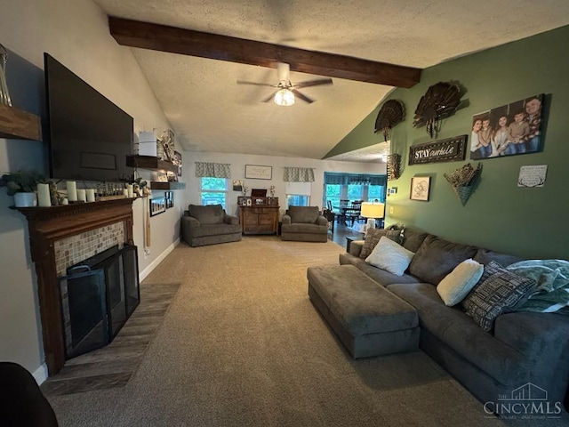 8091 Celestial Cir, Liberty Twp, OH 45044 - carpeted living room featuring beamed ceiling, ceiling fan, a fireplace, plenty of natural light, and high vaulted ceiling