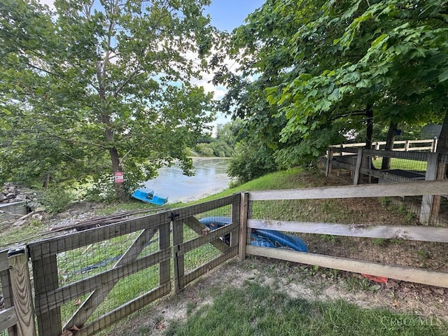 8091 Celestial Cir, Liberty Twp, OH 45044 - view of yard with a gate and a water view