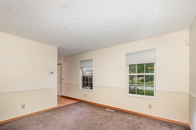 6409 Stapleton Ct, Fairfield Twp, OH 45011 - carpeted spare room featuring a textured ceiling and baseboards