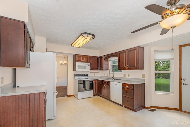 6409 Stapleton Ct, Fairfield Twp, OH 45011 - kitchen featuring white appliances, a ceiling fan, light countertops, healthy amount of natural light, and a textured ceiling