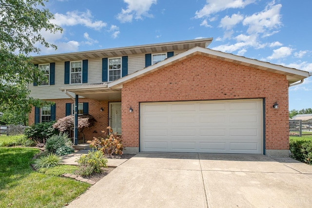 6409 Stapleton Ct, Fairfield Twp, OH 45011 - view of front of home featuring brick siding, concrete driveway, and an attached garage