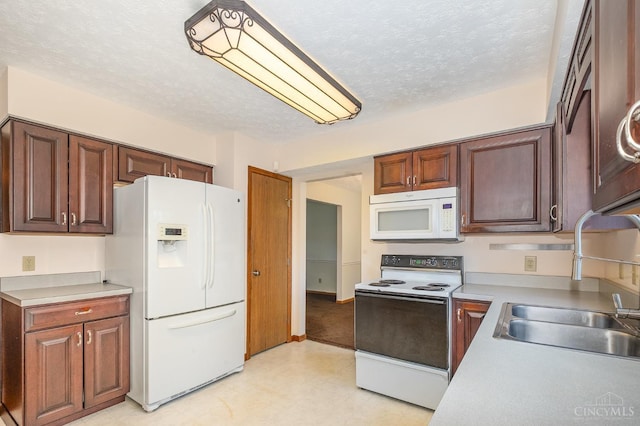6409 Stapleton Ct, Fairfield Twp, OH 45011 - kitchen featuring white appliances, light flooring, light countertops, and a textured ceiling