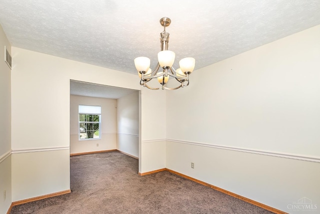 6409 Stapleton Ct, Fairfield Twp, OH 45011 - carpeted spare room with a chandelier and a textured ceiling