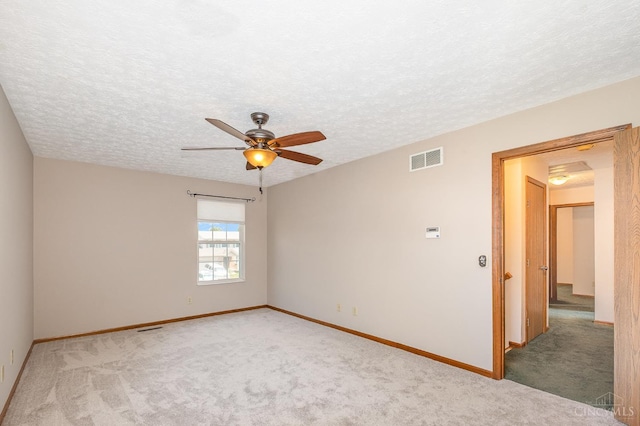 6409 Stapleton Ct, Fairfield Twp, OH 45011 - empty room with light carpet, a ceiling fan, and a textured ceiling