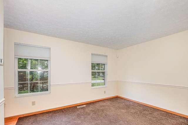 6409 Stapleton Ct, Fairfield Twp, OH 45011 - carpeted empty room with a textured ceiling